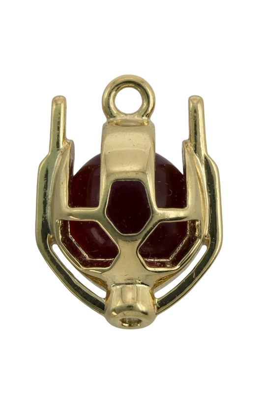 Polished gold ladybug beetle with glossy red enamel panels and cutout details