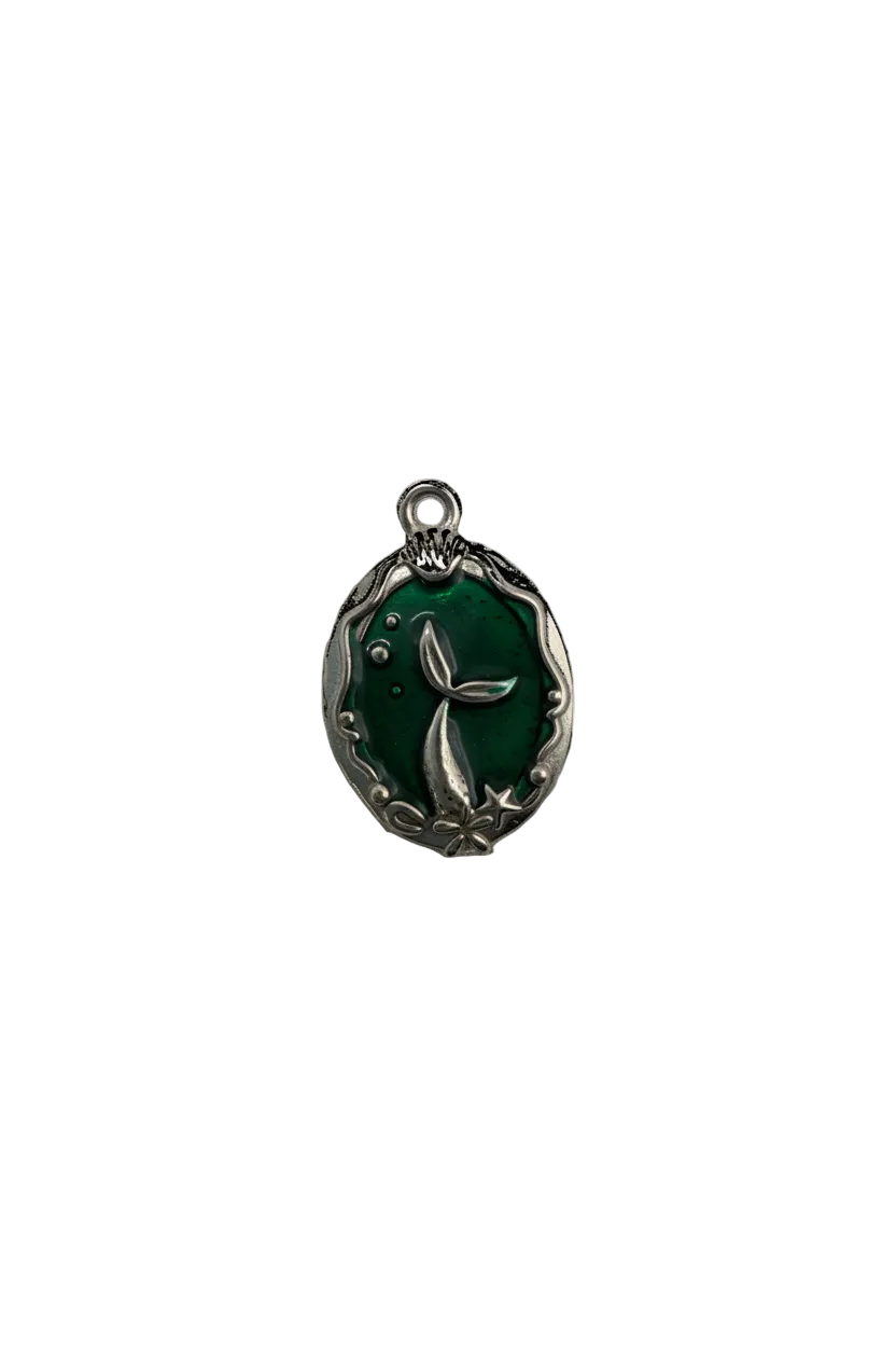 Emerald green oval with silver whale tail and star details