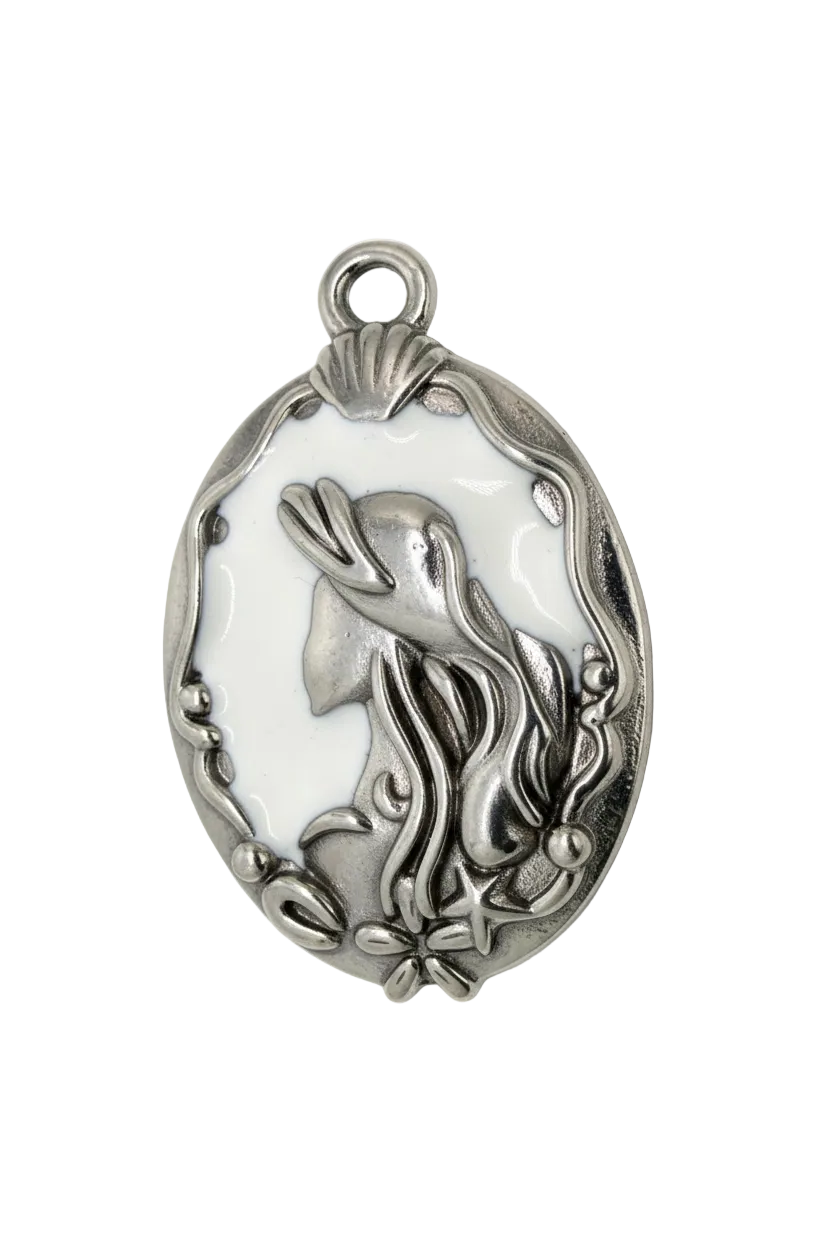 Oval silver medallion with white enamel and raised bird with floral vine details