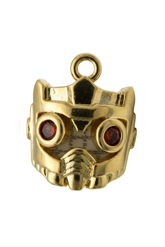 Polished gold skull head with two red gem eyes