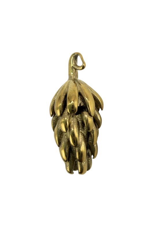 Gold pinecone pendant with raised textured scales and glossy finish on black background