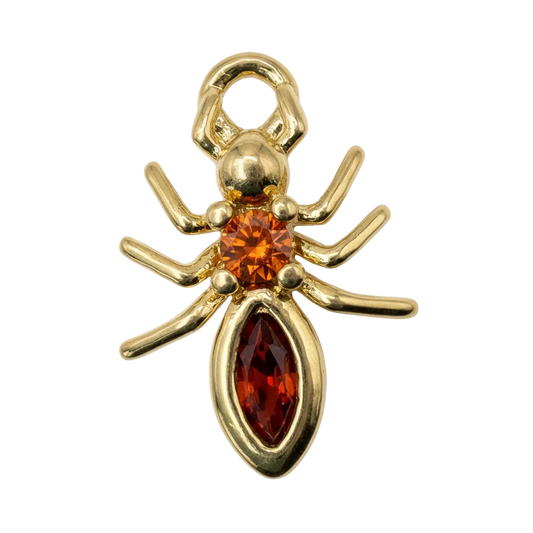 Gold spider charm with orange faceted gem center and deep red marquise gem body