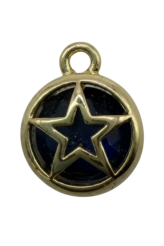 Round gold medallion with raised star over glossy navy enamel