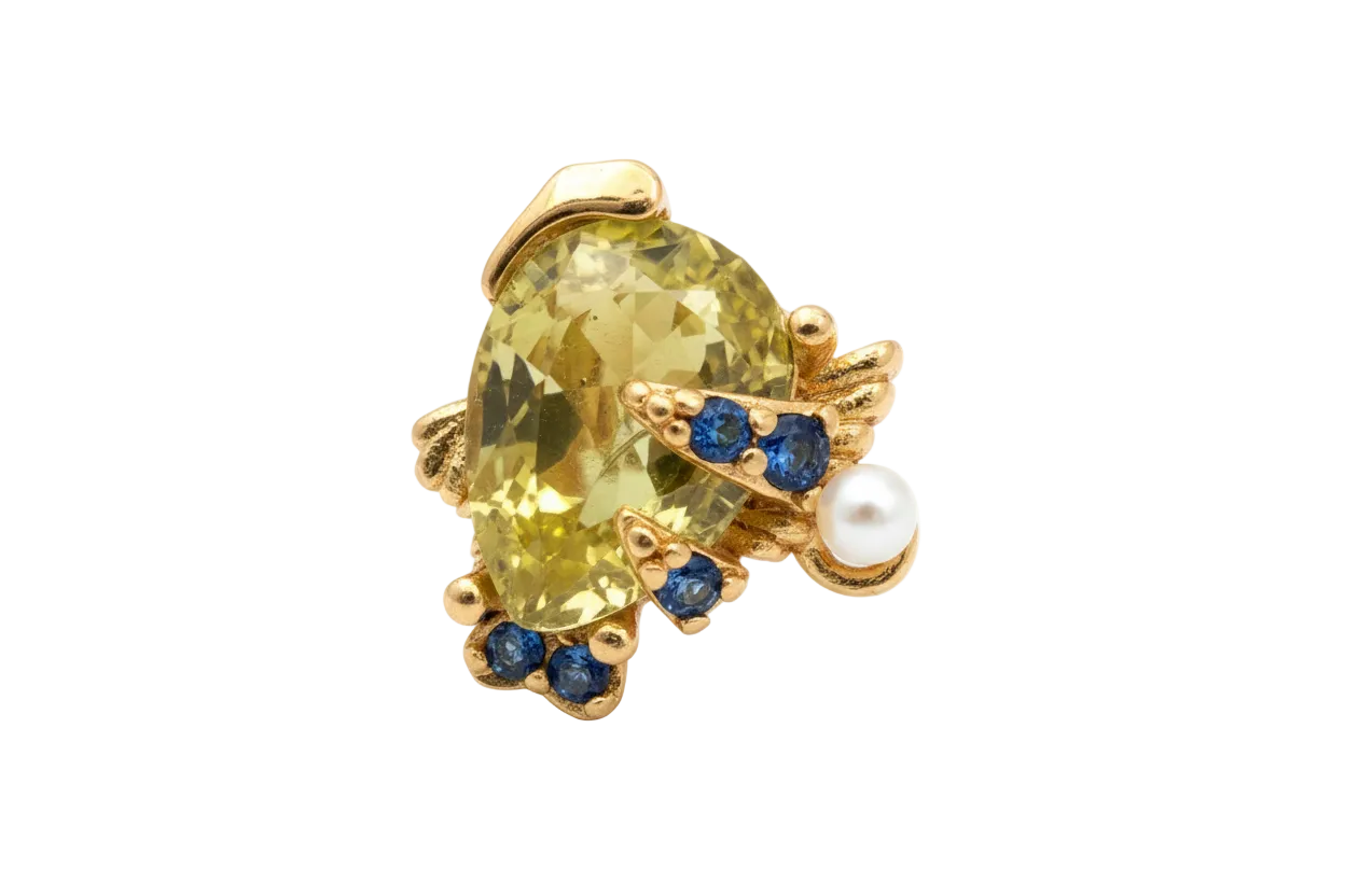 Gold turtle charm with faceted yellow gem shell and blue gem accents