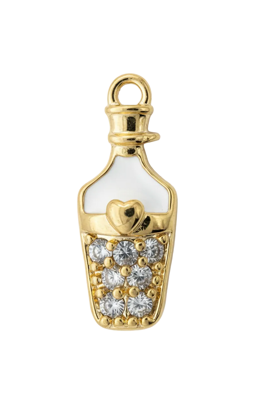 Gold baby bottle charm with clear pav  gems, white enamel, and a small heart detail