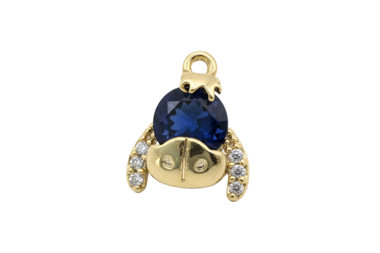 Gold bear motif with faceted midnight-blue round gem and clear crystal accents