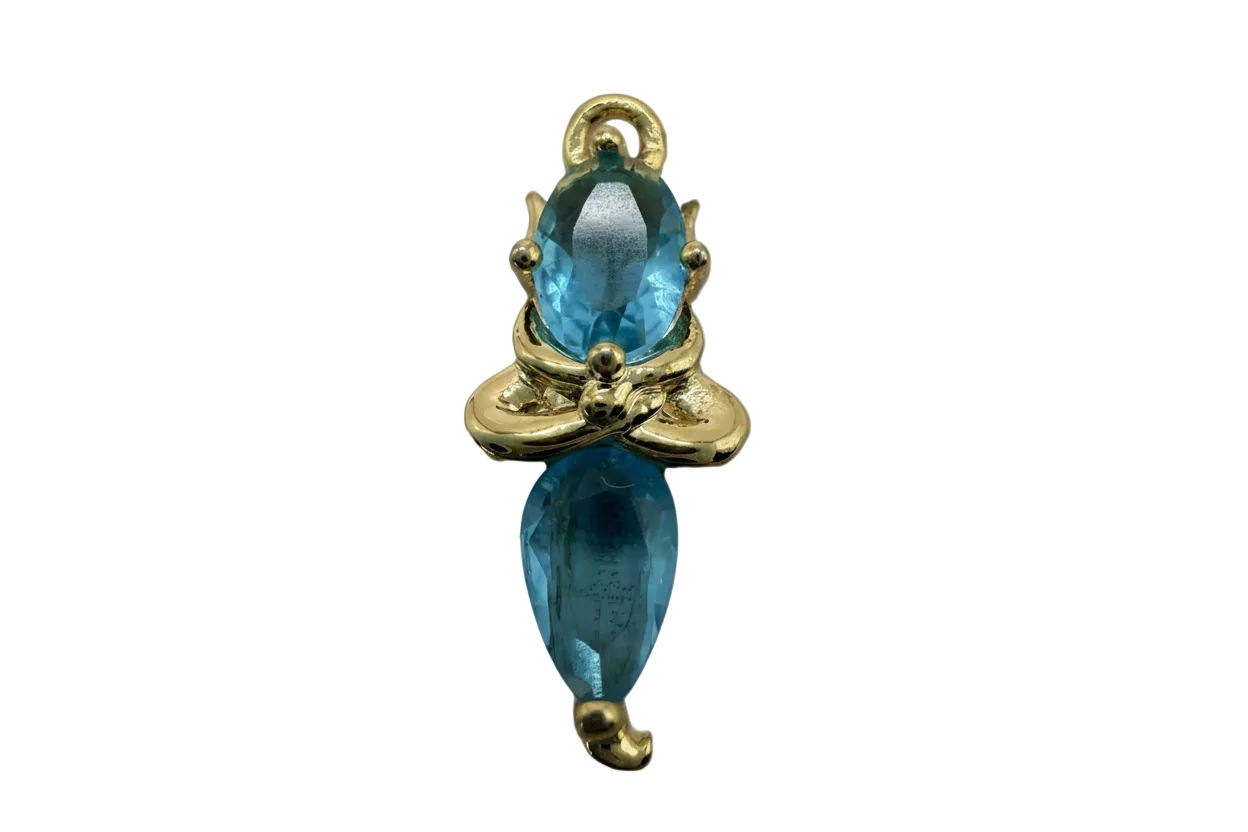 Gold bow charm with two faceted aqua blue gemstones in oval and marquise cuts