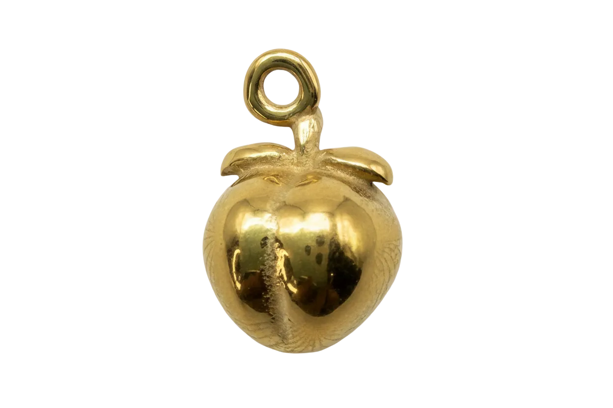 High-polish gold peach fruit charm with sculpted leaf and glossy finish