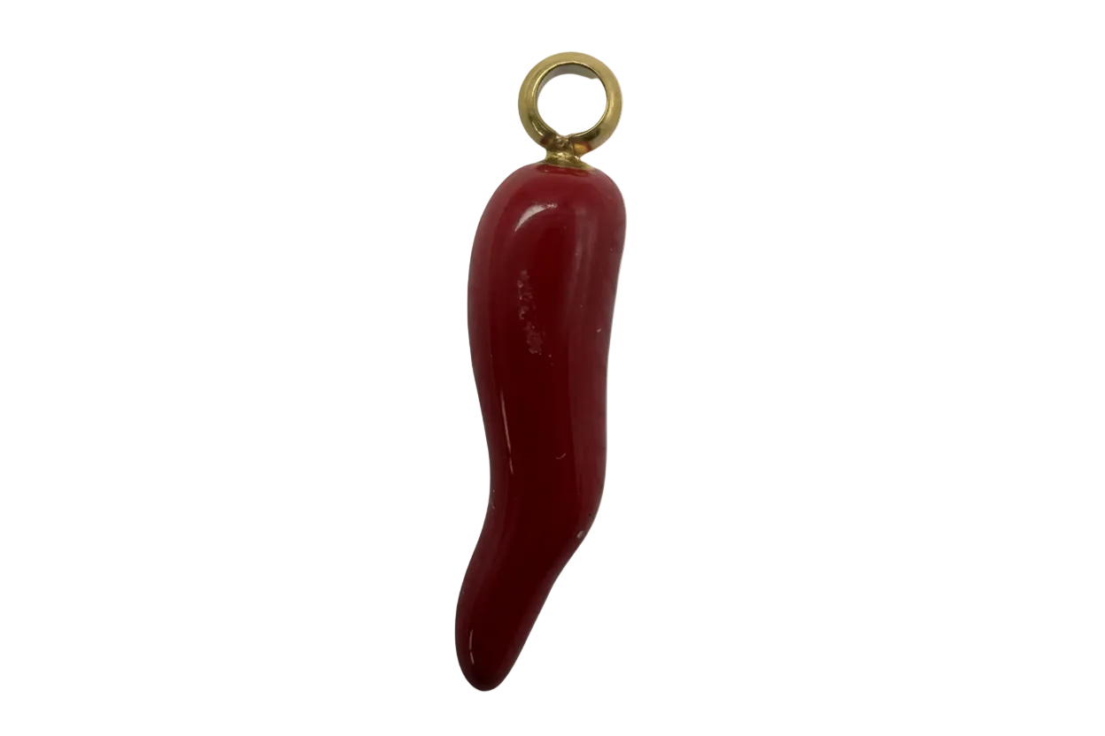 Glossy red chili pepper charm with polished gold finish on black background