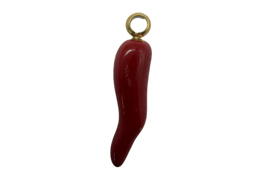 Glossy red chili pepper charm with polished gold finish on black background
