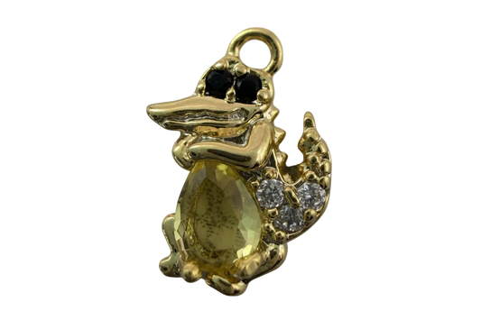 Gold crocodile figure with faceted yellow oval gem, black eyes, and clear crystal accents