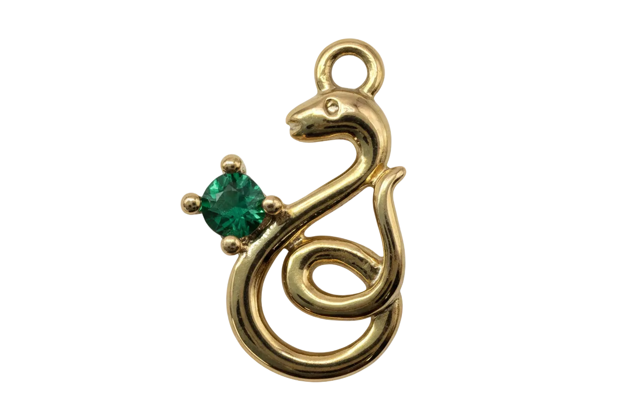Polished gold treble clef charm with a square green gem accent