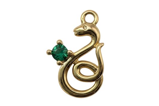 Polished gold treble clef charm with a square green gem accent