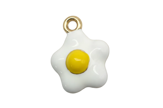Glossy white fried egg charm with yellow yolk and gold accents