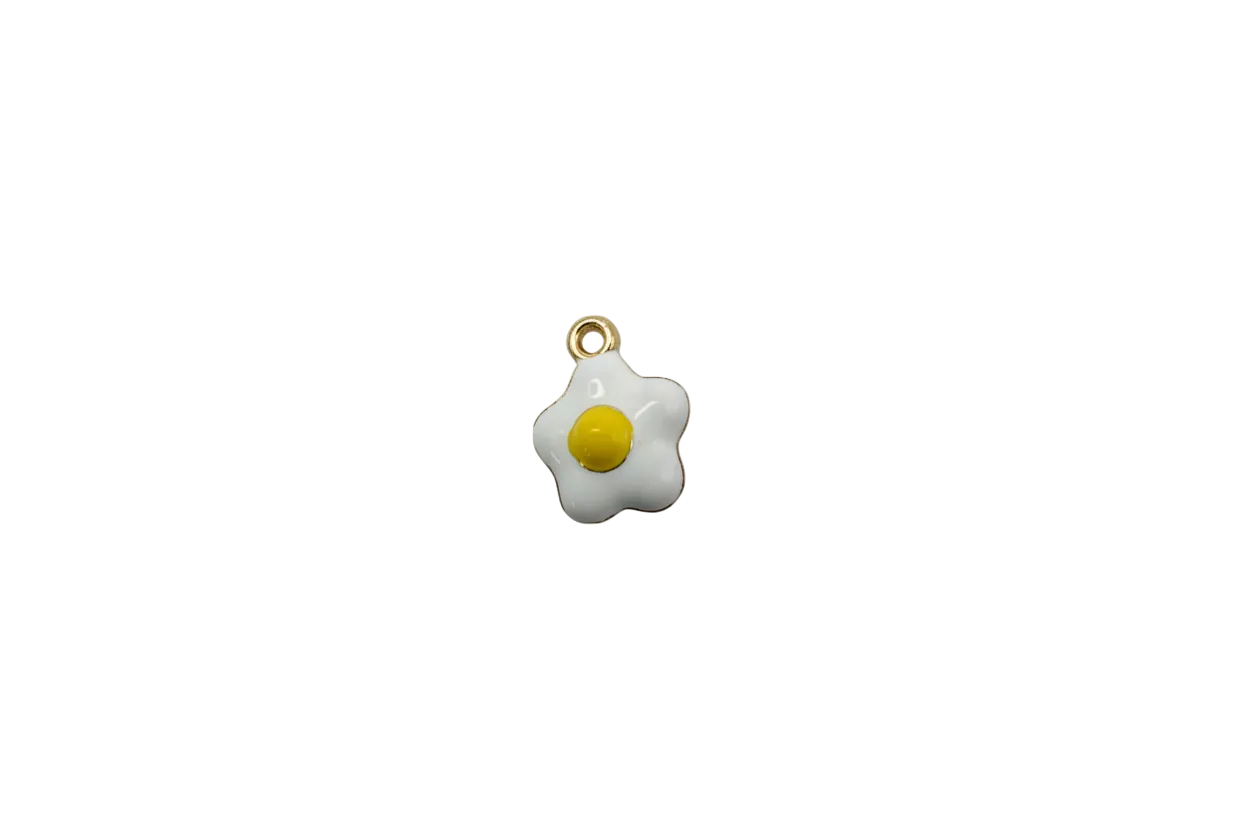 White fried egg with yellow yolk and gold accents