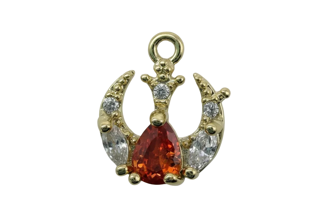 Gold crown motif with pear-cut burnt orange gem and clear crystals