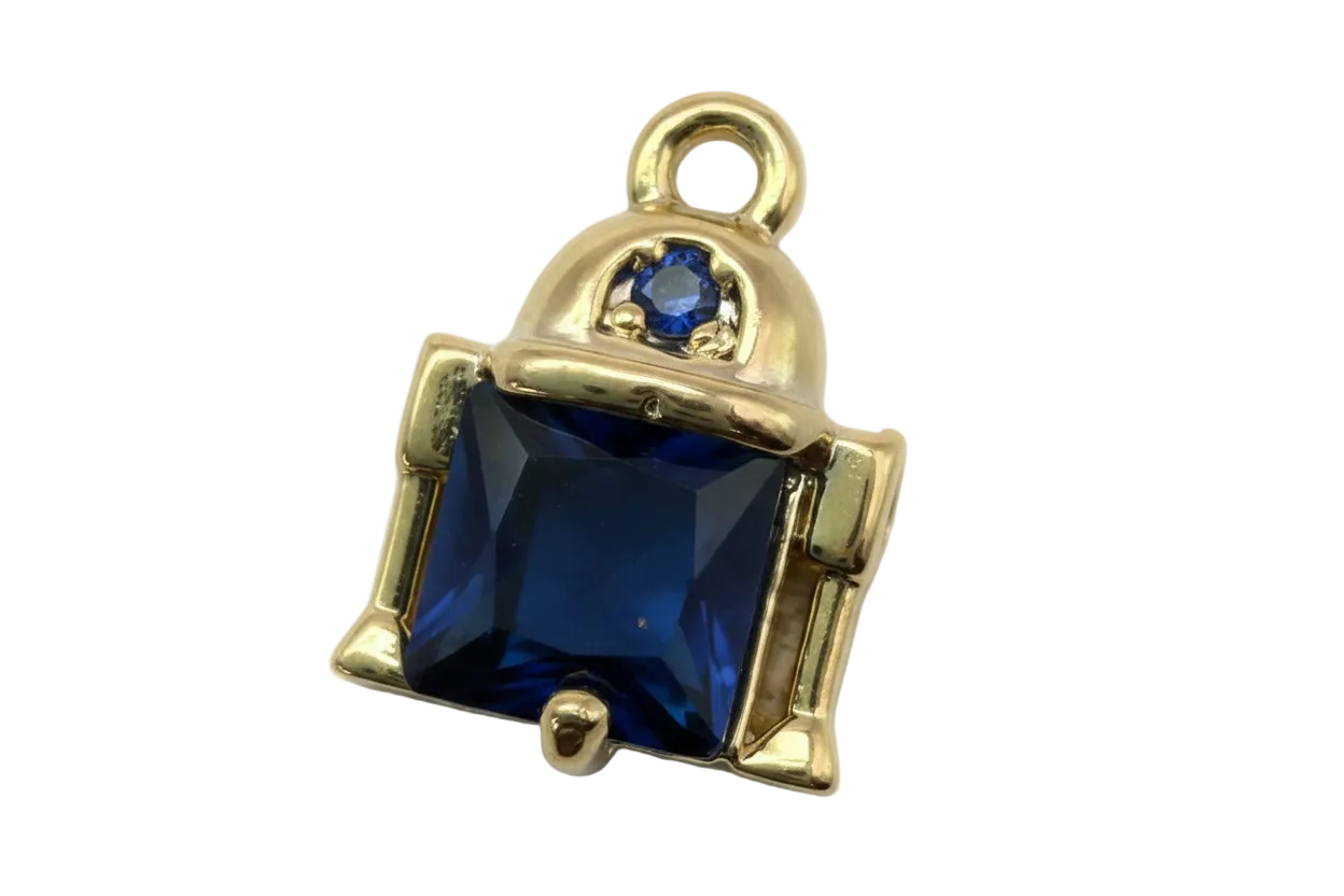 Gold-framed faceted navy square gem with small navy accent stone