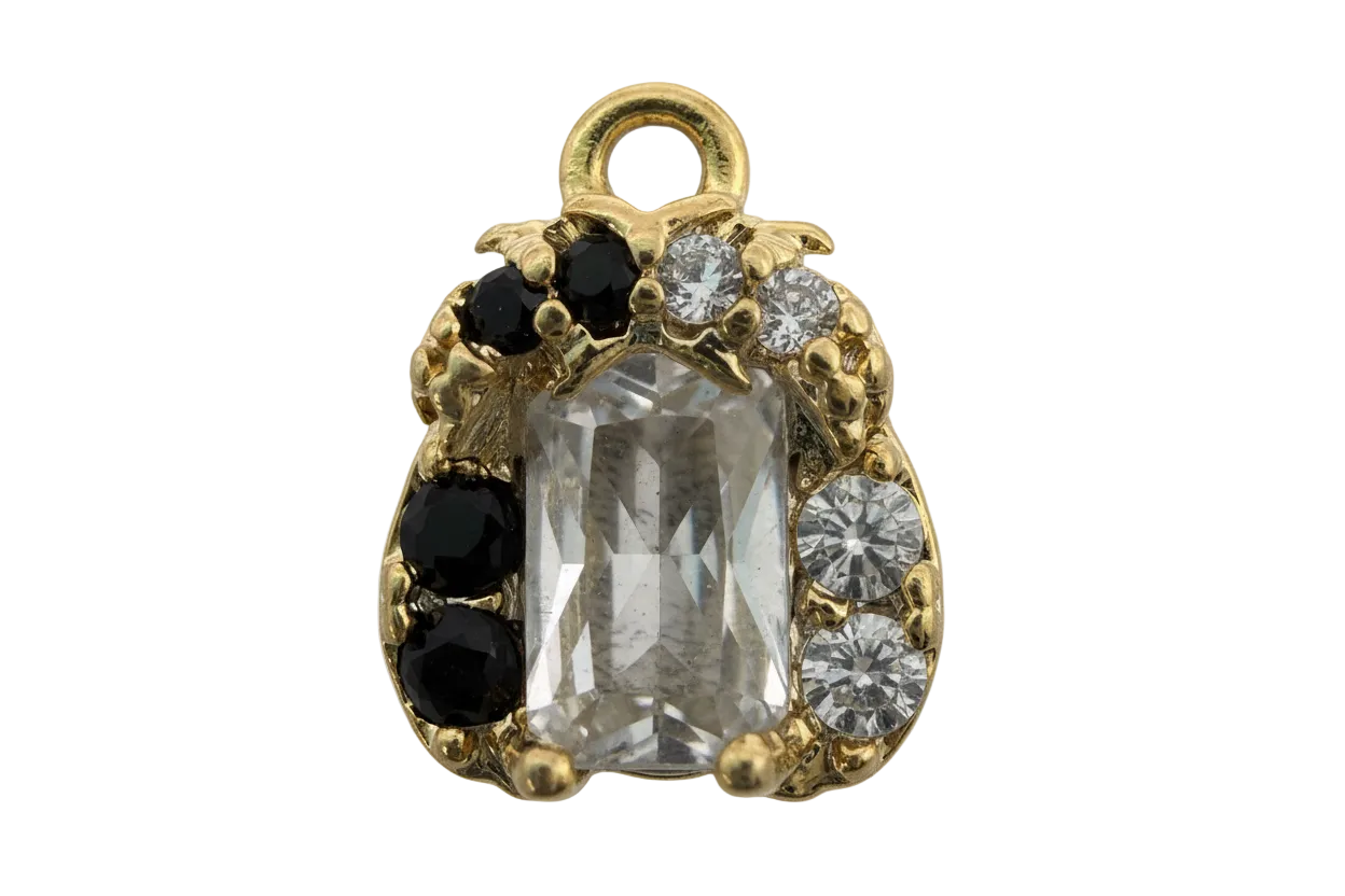 Gold ladybug charm with faceted clear center stone and black and clear crystal accents