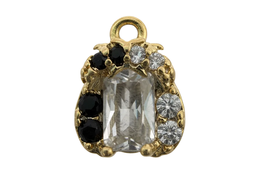 Gold ladybug charm with faceted clear center stone and black and clear crystal accents