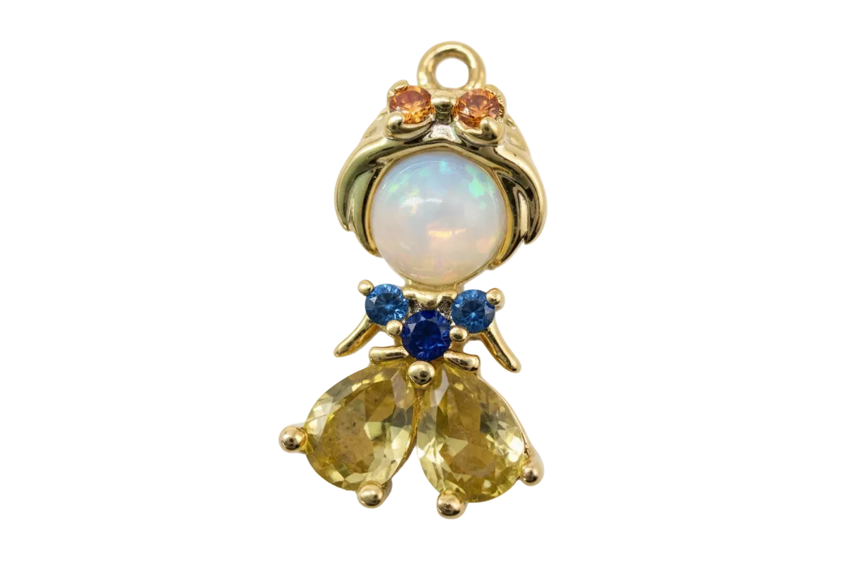 Gold angel figure charm with opalescent orb, amber and blue crystals, and faceted yellow stones