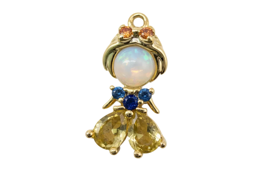 Gold angel figure charm with opalescent orb, amber and blue crystals, and faceted yellow stones