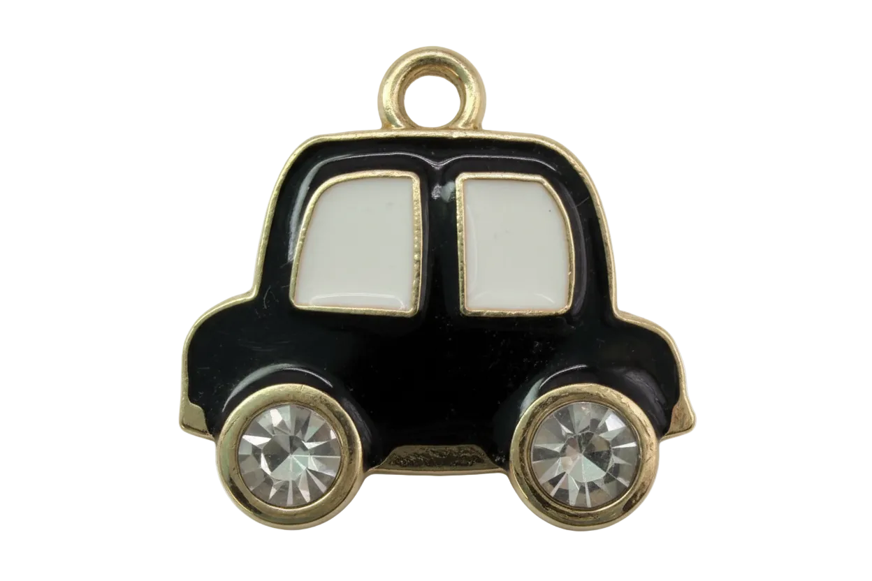Black enamel car silhouette with gold trim, white windows, and two clear crystal wheels