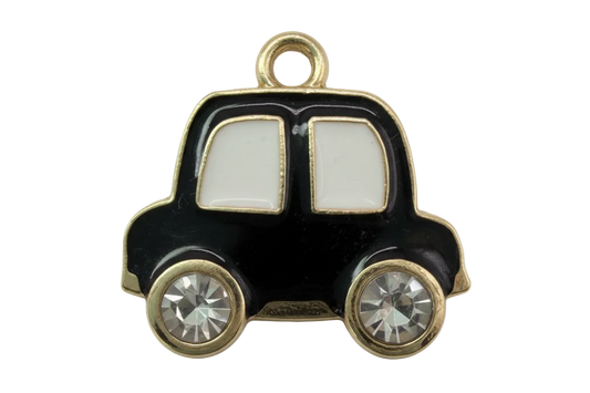 Black enamel car silhouette with gold trim, white windows, and two clear crystal wheels