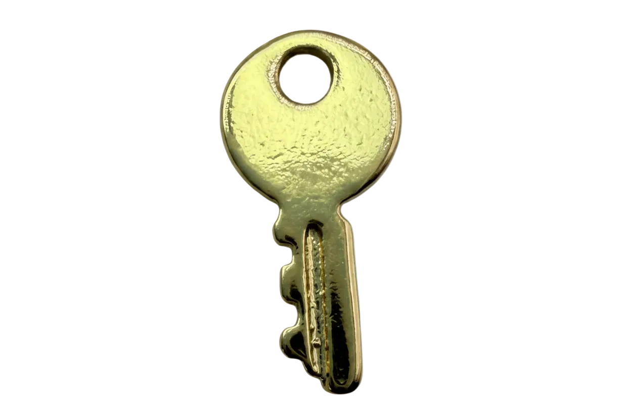 Glossy gold key silhouette with rounded head and notched edge