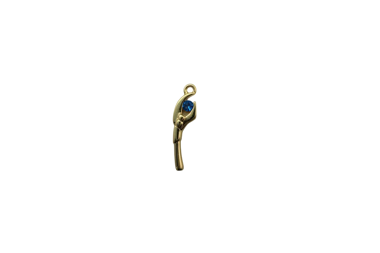 Gold hand holding a faceted blue gem
