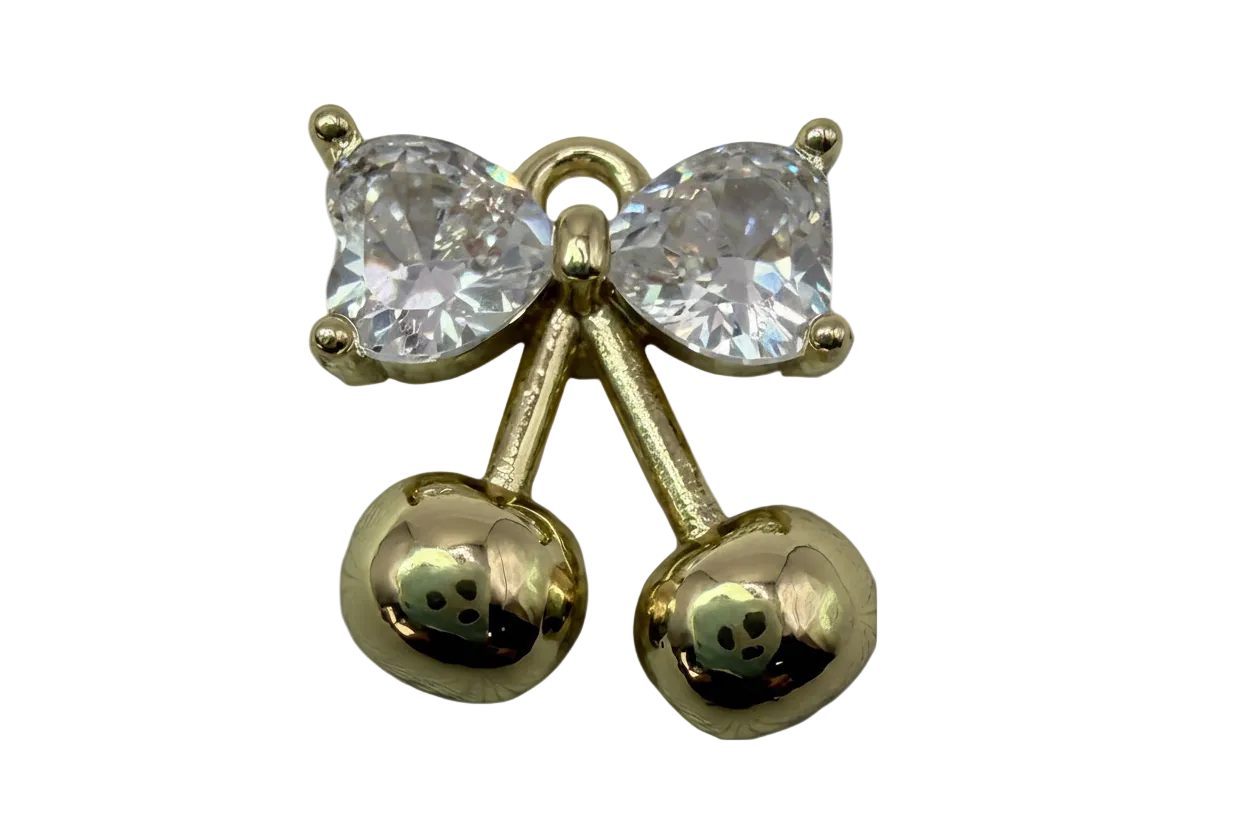 Polished gold cherry pair with clear faceted crystal bow