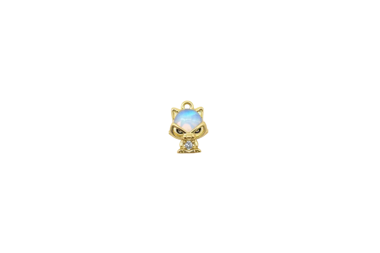Gold cat with opalescent blue dome and clear gem