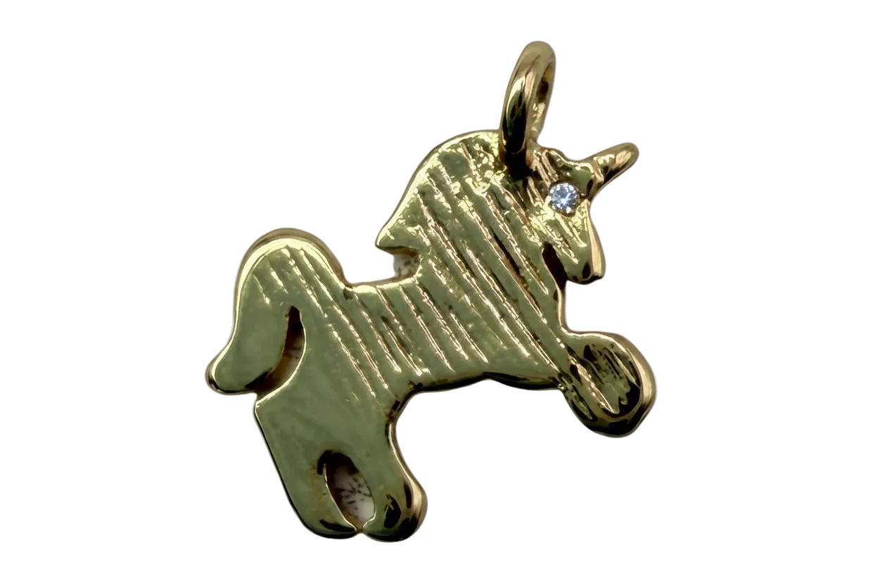 Textured gold airplane silhouette charm with polished finish