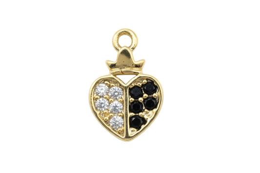 Gold split heart charm with clear pavé stones on one side and black stones on the other