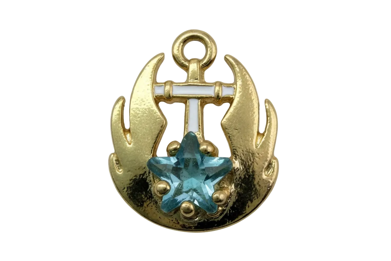 Gold anchor medallion with white enamel pattern and faceted aqua star gem