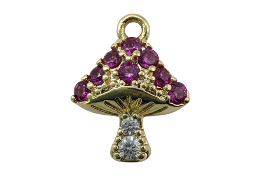 Gold mushroom charm with purple faceted gems and clear crystal accents