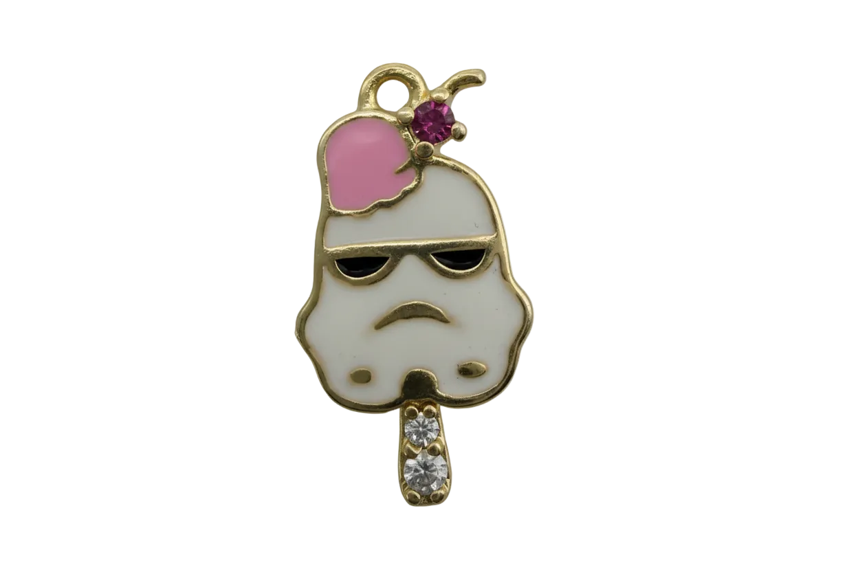 Gold-tone popsicle face with white enamel, black sunglasses, pink heart, purple gem, and two clear crystals