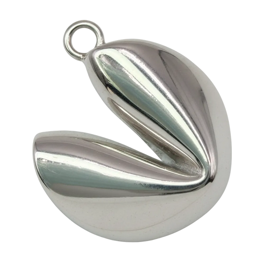 Mirror-polished silver puff heart with a folded sculptural shape