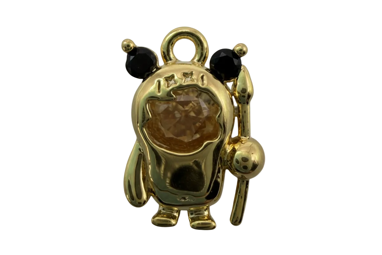 Gold panda figure with black ears and eyes, star details, and a honey-brown domed gem center, holding a staff