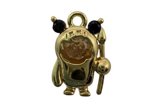 Gold panda figure with black ears and eyes, star details, and a honey-brown domed gem center, holding a staff