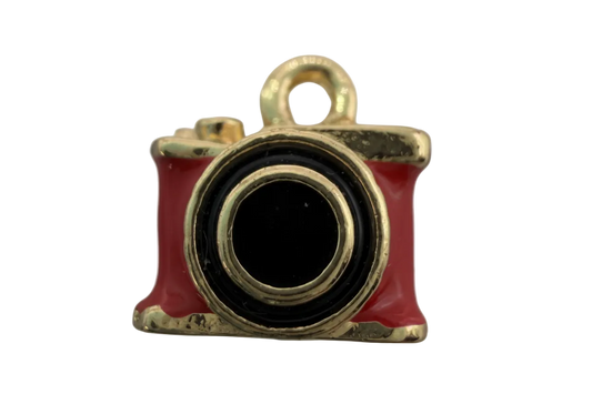 Red enamel camera charm with black lens and gold-tone trim