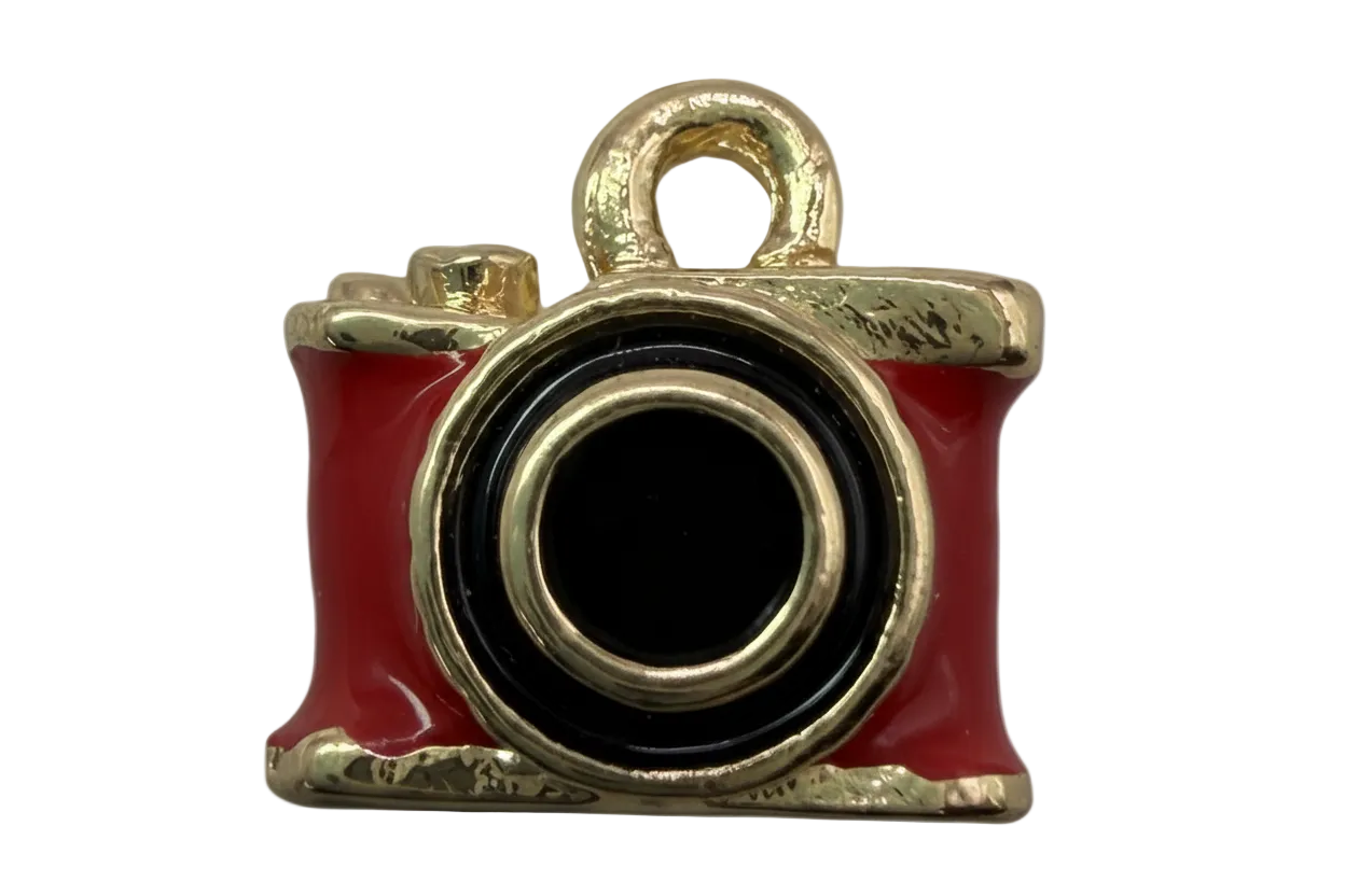 Red enamel camera pendant with black lens and polished gold-tone trim