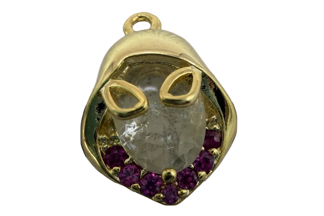 Gold cat face with faceted clear crystal center and purple stones