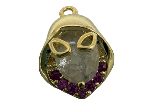 Gold cat face with faceted clear crystal center and purple stones