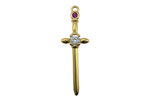 Gold sword charm with clear faceted round gem and purple accent stone