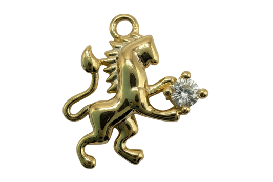 Glossy gold gecko charm with a clear round faceted gem accent