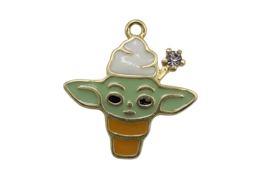 Winking green alien ice cream cone with white topping, gold outline, and tiny pink gem accent