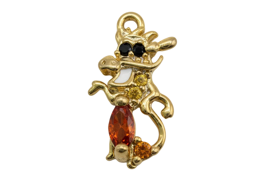 Gold cat silhouette charm with orange marquise gem, amber accents, black eyes, and bow detail