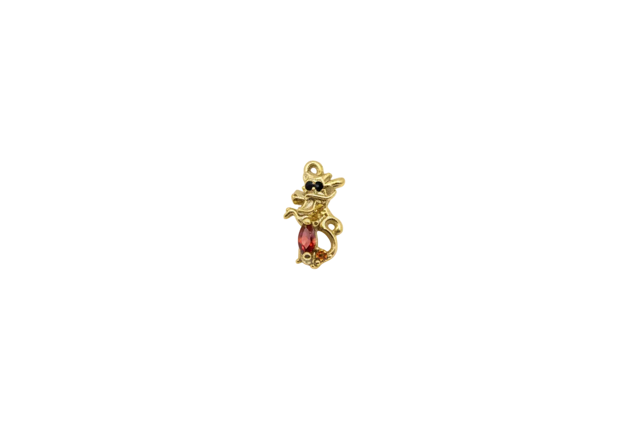 Gold cat silhouette with orange gem, amber accents, and bow