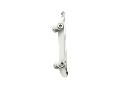 Polished silver miniature skateboard with sculpted truck details