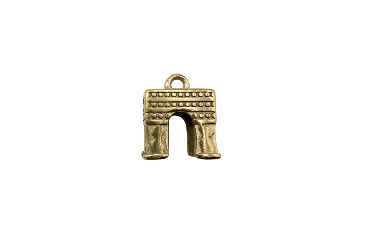 Gold archway monument with stud details, antiqued finish